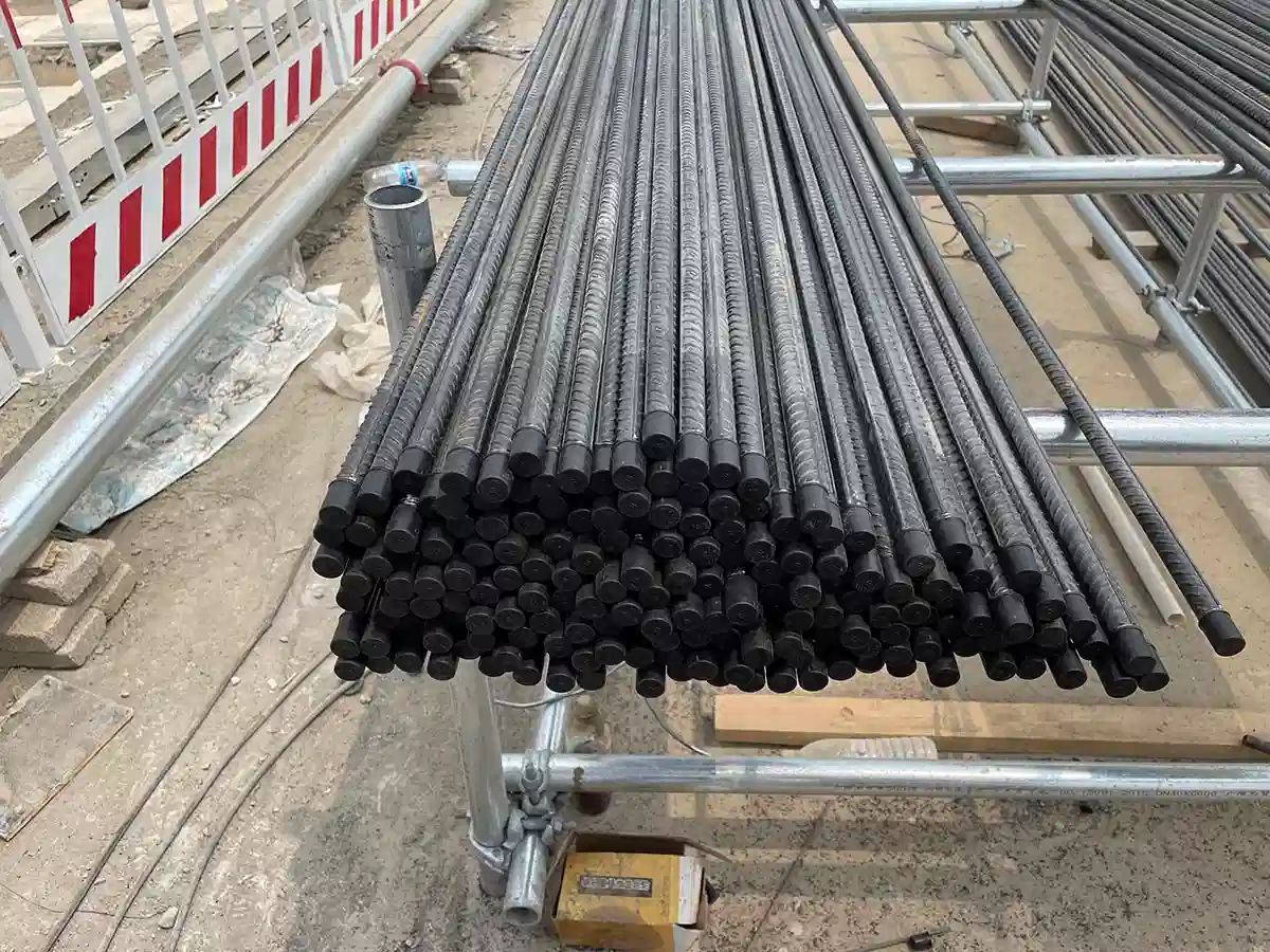 Steel bars with protective caps